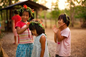 Three girls wearing flower crowns together