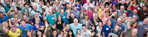 A group of people cheering together