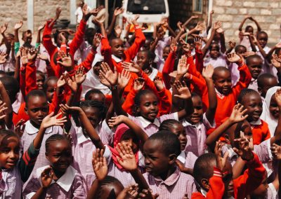 A Group of children waving their hands