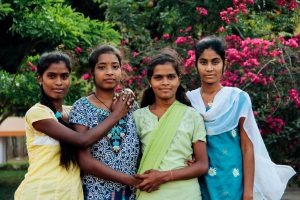 Four girls posing together.