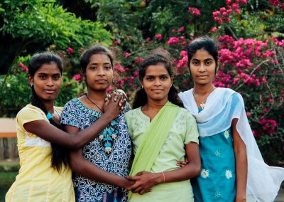 Four girls posing together.