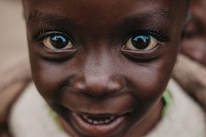 Close up of a smiling child's face.