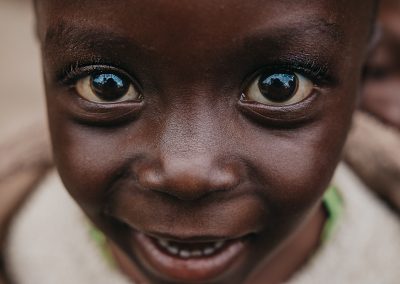 Close up of a smiling child's face.