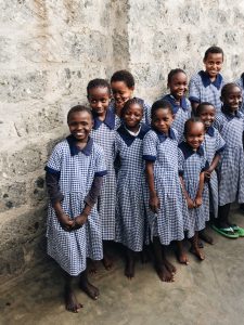 A group of smiling and laughing girls.