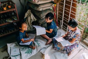 Three girls studying together.