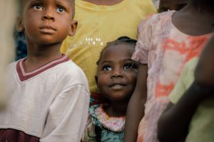 Picture of a smiling girl in a group.