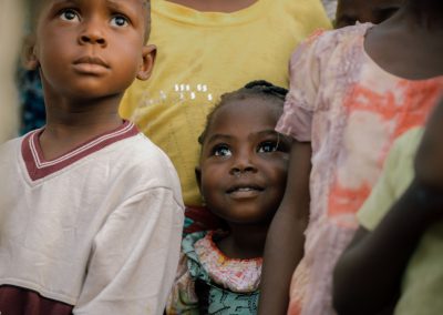 Picture of a smiling girl in a group.