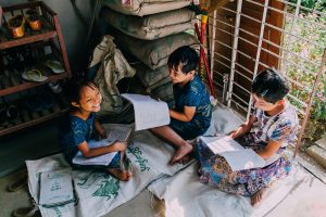 Three girls studying together