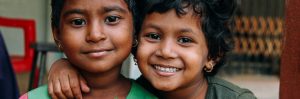 Two children smiling together