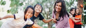 A Woman Posing with two girls